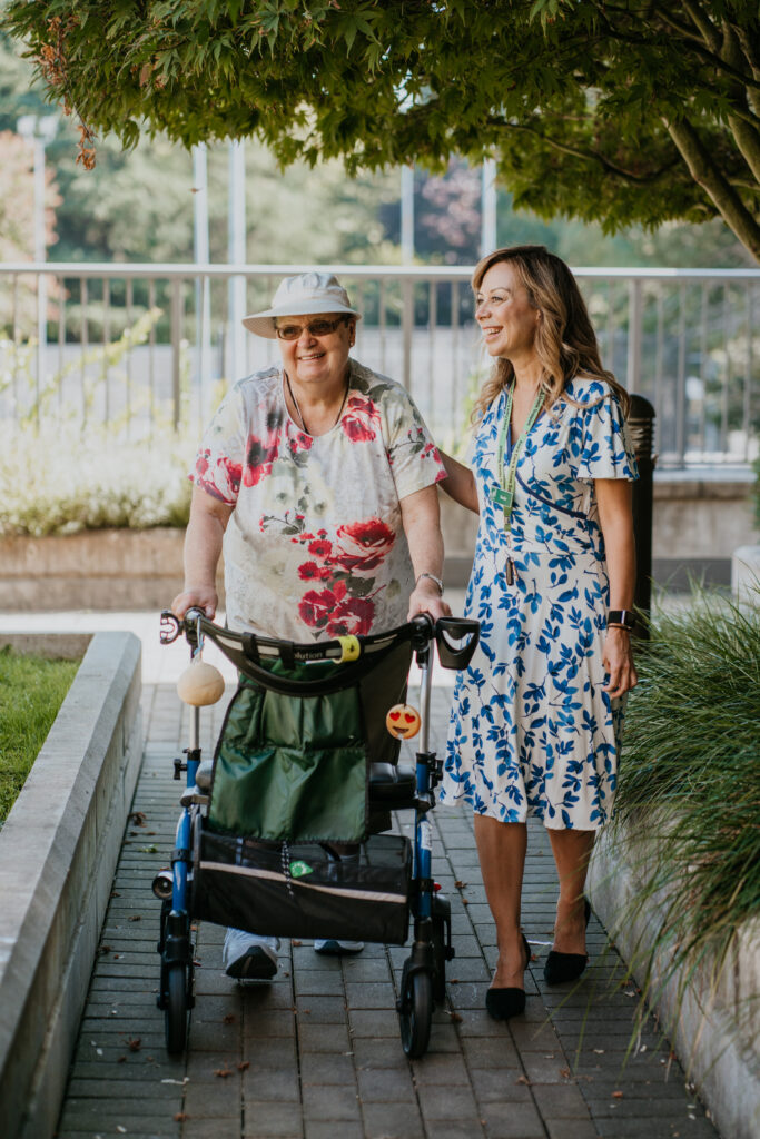 Susana happily walking and caring for a patient